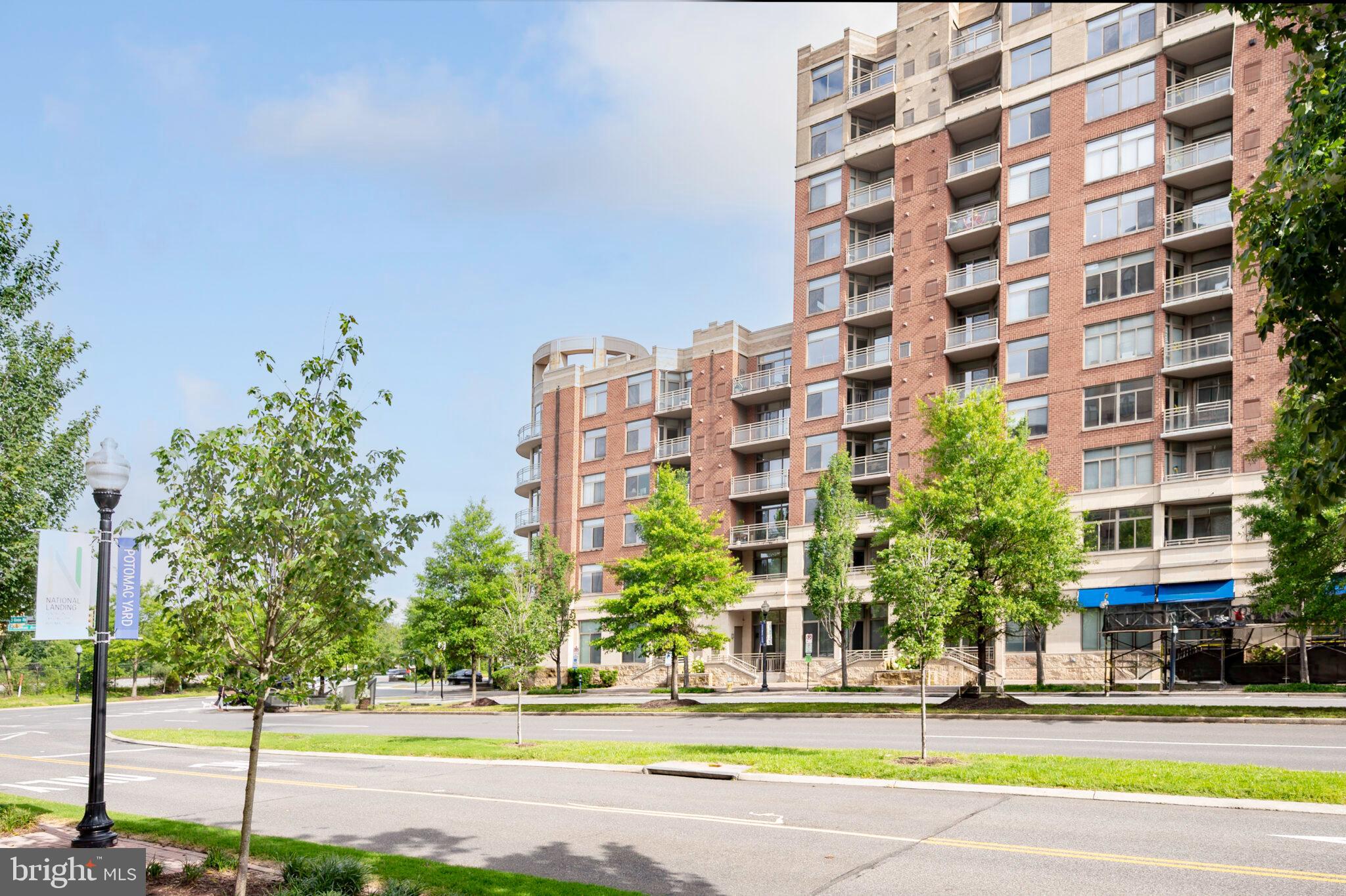 3650 South Glebe Road, Unit 450 Arlington, VA 22202 - Photo 49 of 60 a view of a tall building next to a yard
