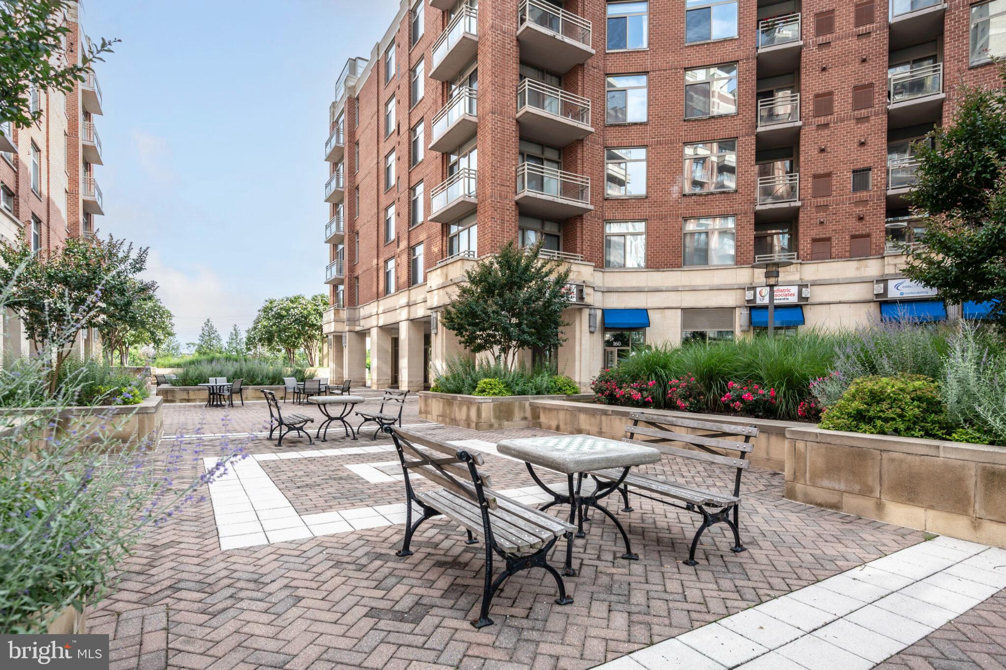3650 South Glebe Road, Unit 450 Arlington, VA 22202 - Photo 50 of 60 a view of a building with garden and sitting area