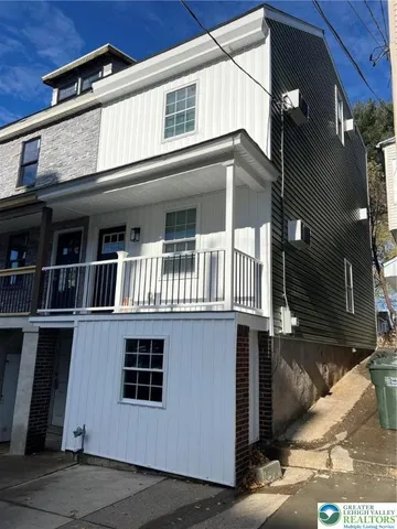 a front view of a house with a garage