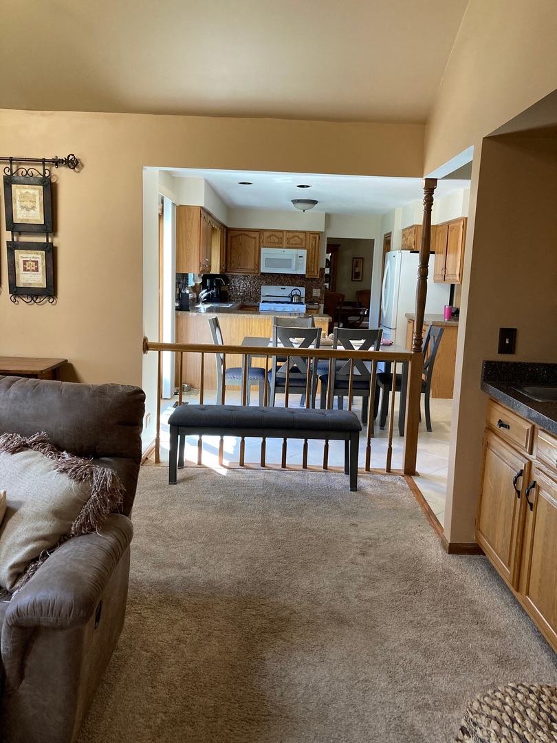 36 Redstart Road Naperville, IL 60565 - Photo 11 of 38 a living room with furniture and a flat screen tv