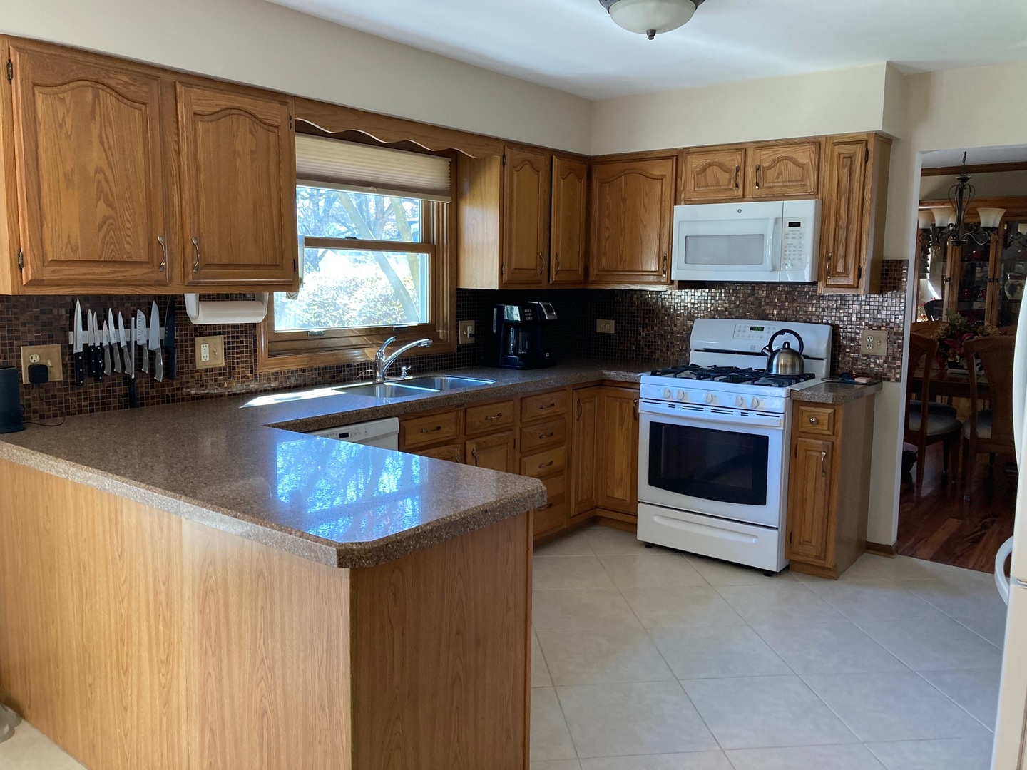 36 Redstart Road Naperville, IL 60565 - Photo 13 of 38 a kitchen with stainless steel appliances granite countertop a sink stove and cabinets