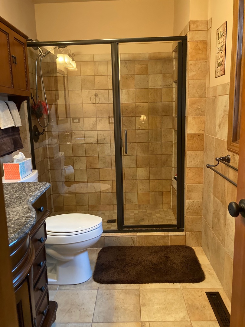36 Redstart Road Naperville, IL 60565 - Photo 22 of 38 a bathroom with a shower a toilet and a shower