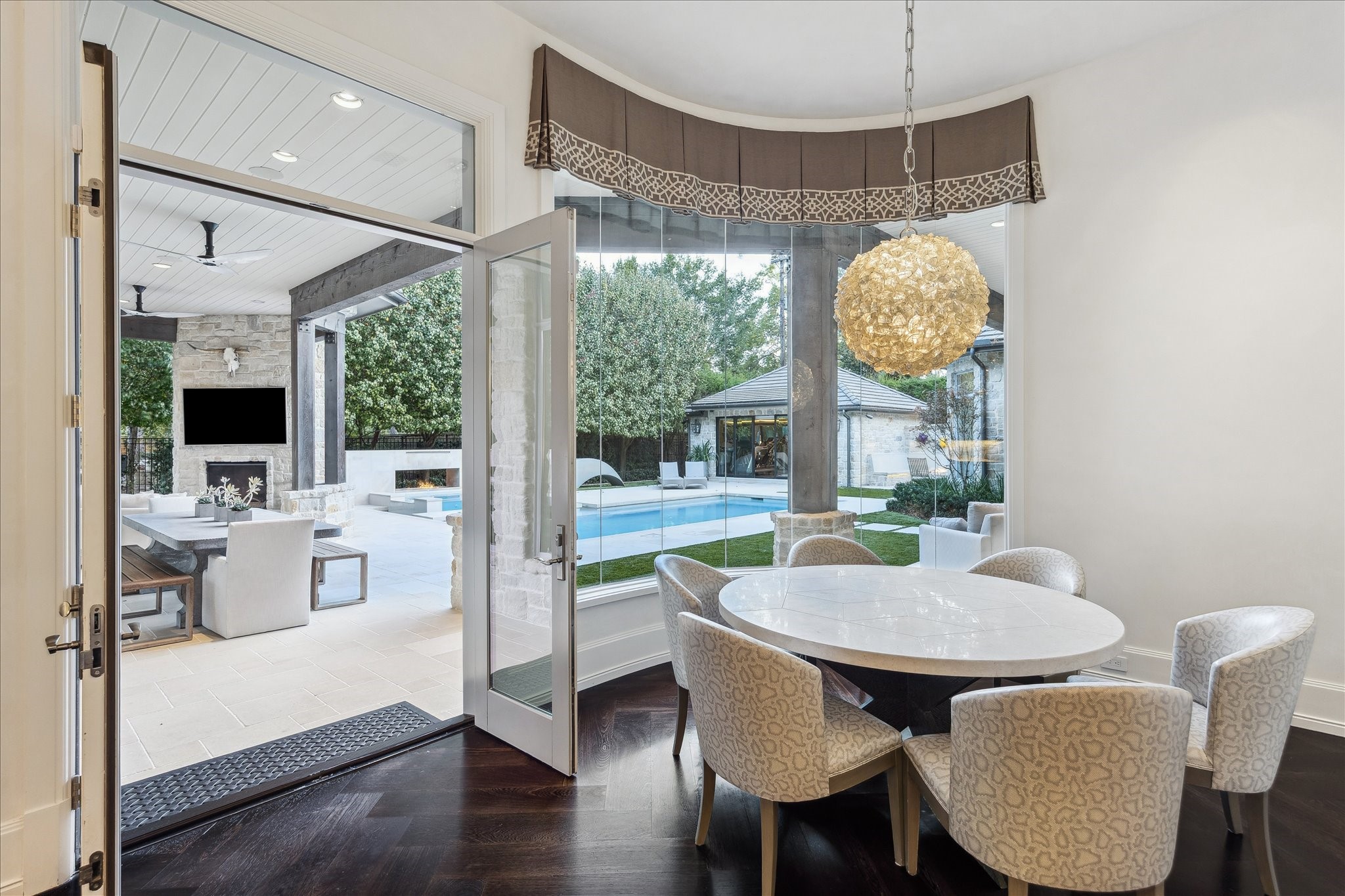 220 Merrie Way Lane Houston, TX 77024 - Photo 14 of 50 a view of a dining room with furniture wooden floor and chandelier