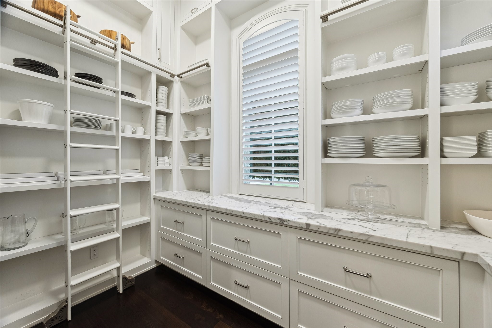 220 Merrie Way Lane Houston, TX 77024 - Photo 18 of 50 a kitchen with a granite countertop cabinets and window
