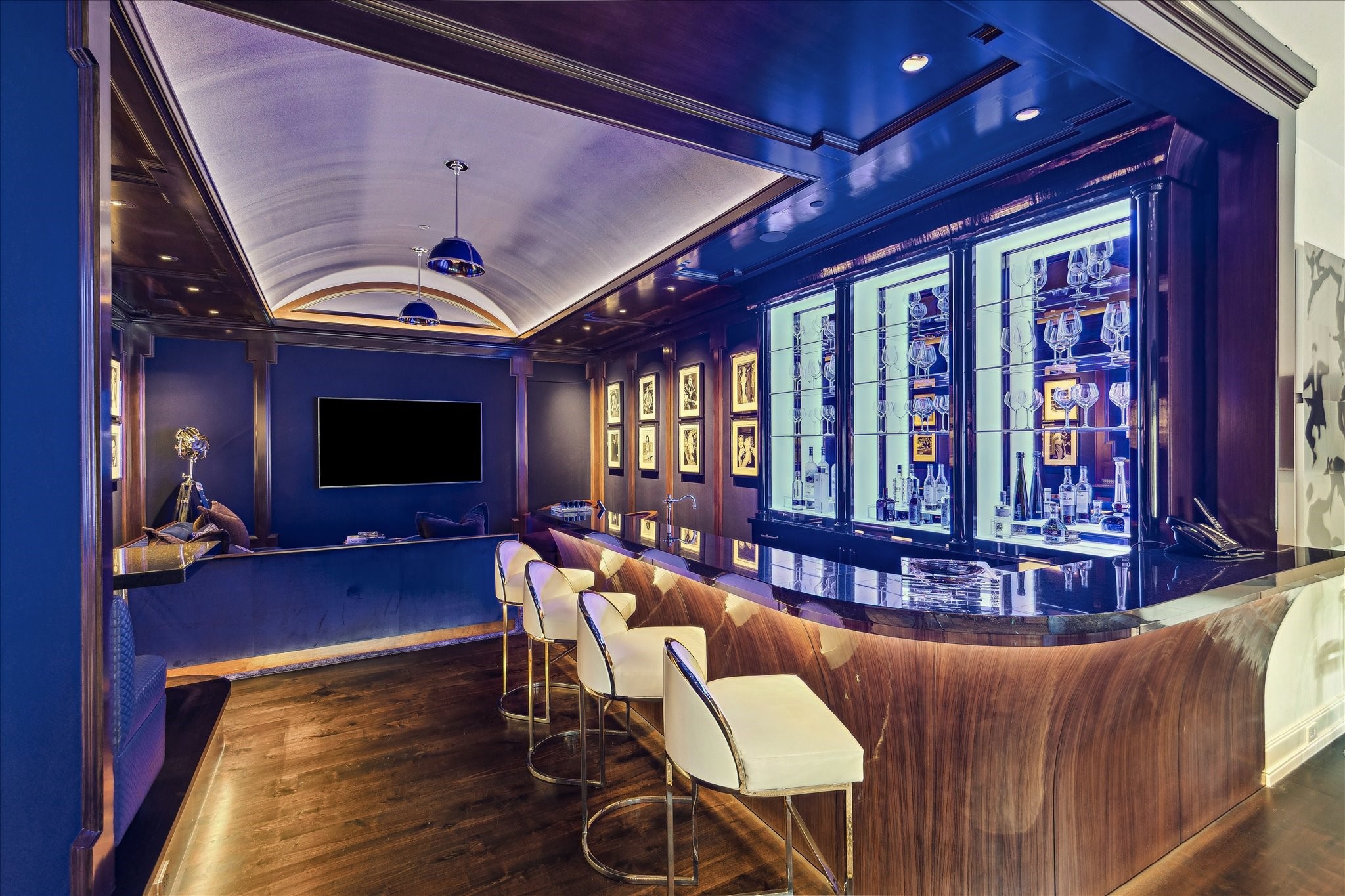 220 Merrie Way Lane Houston, TX 77024 - Photo 35 of 50 a living room with furniture a flat screen tv and wooden floor