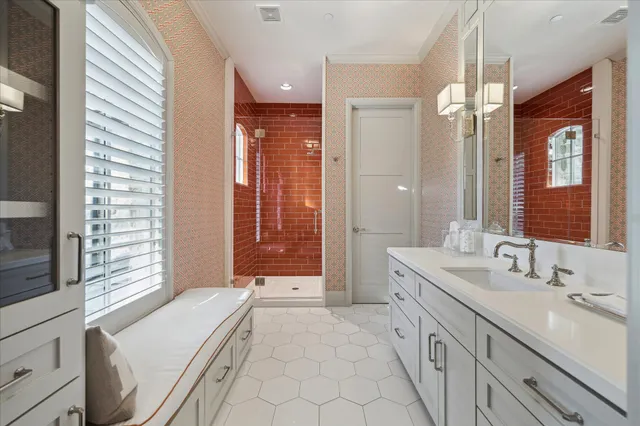 a spacious bathroom with a double vanity sink a large mirror and a bathtub