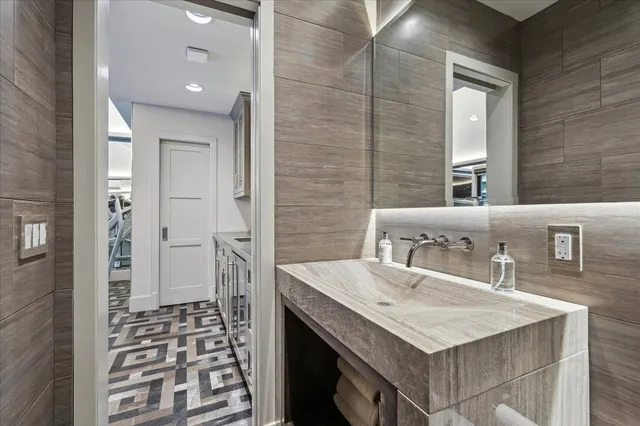 a bathroom with a sink a vanity and a mirror