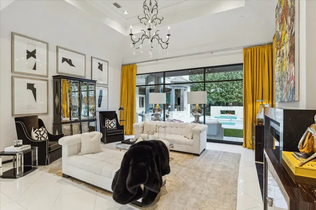 a living room with fireplace furniture and a flat screen tv