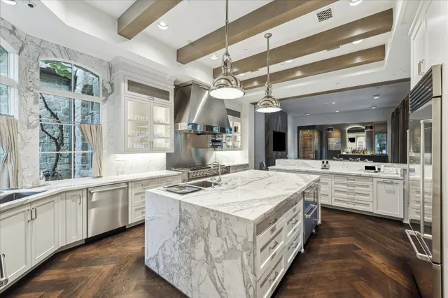 a kitchen with stainless steel appliances granite countertop a stove oven and a refrigerator