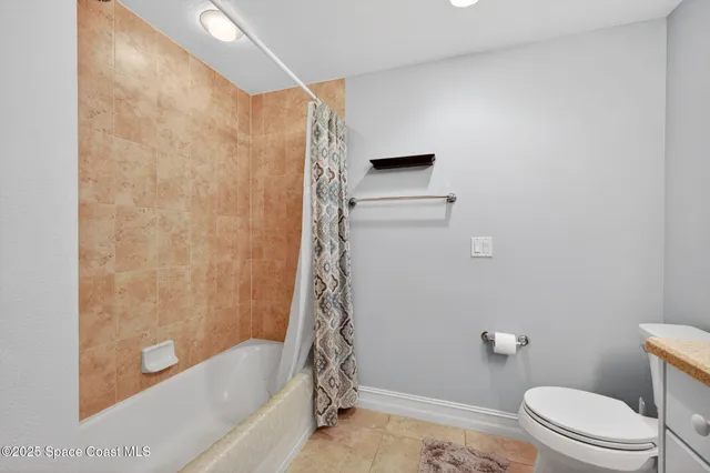 a bed room with a bed window and a couch