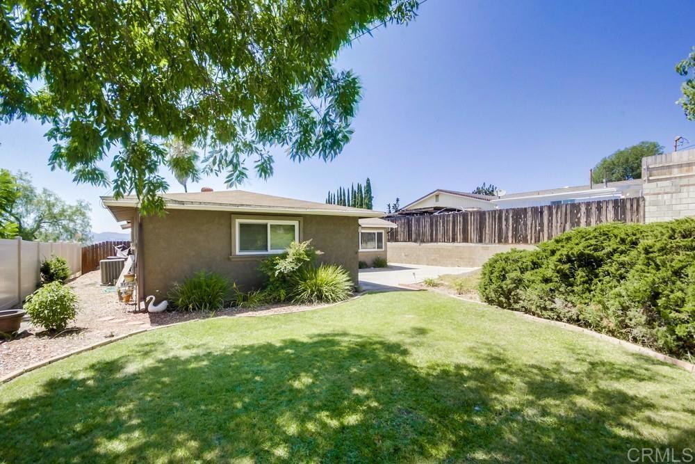 7932 Shalamar Drive El Cajon, CA 92021 - Photo 21 of 22 a view of a house with a yard and potted plants
