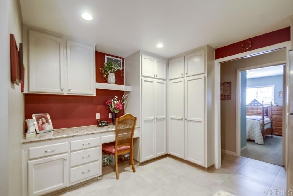 7932 Shalamar Drive El Cajon, CA 92021 - Photo 7 of 22 a kitchen with a refrigerator and cabinets