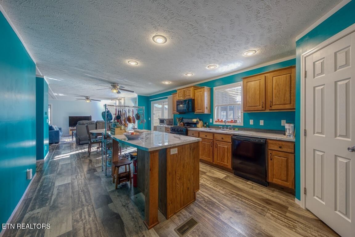 3143 Webbing Way Cosby, TN 37722 - Photo 6 of 31 a kitchen with lots of counter top space and stainless steel appliances