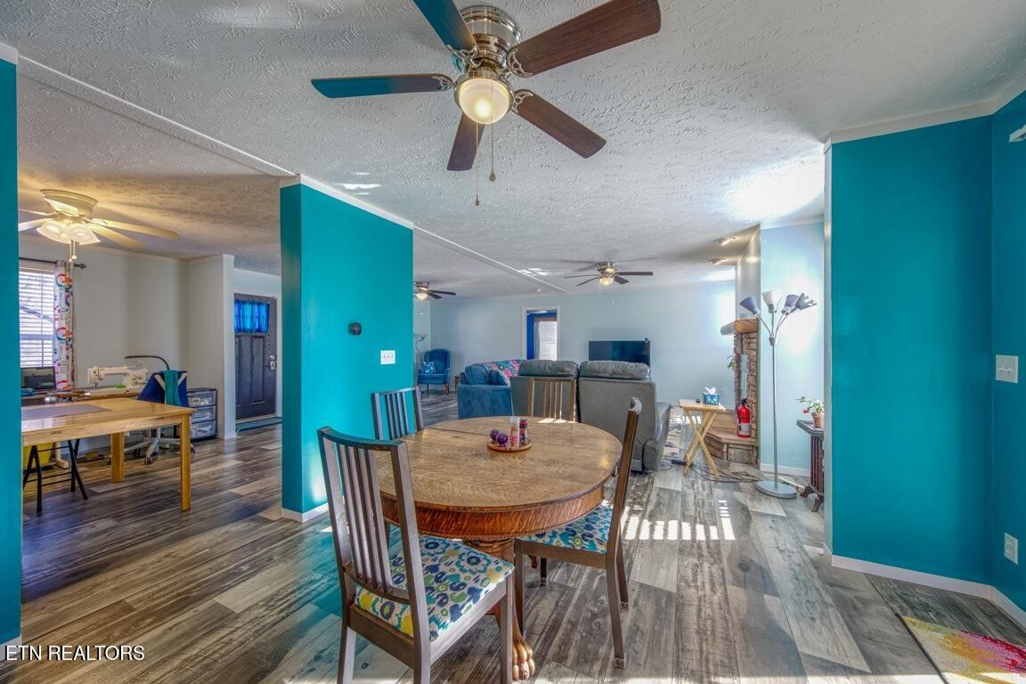 3143 Webbing Way Cosby, TN 37722 - Photo 8 of 31 a view of a dining room with furniture and wooden floor