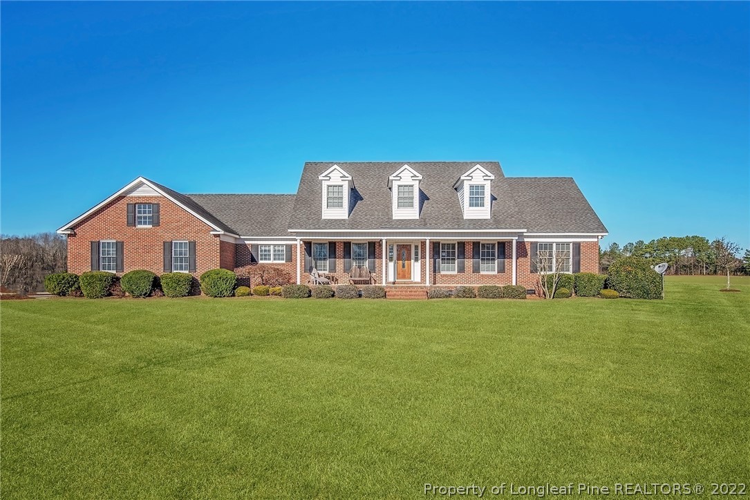 428 Rob Road Stedman, NC 28391 - Photo 1 of 45 a front view of a house with a garden