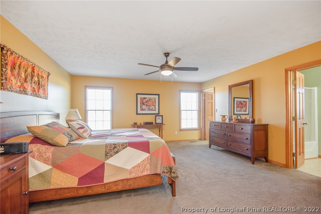 428 Rob Road Stedman, NC 28391 - Photo 20 of 45 a bed room with a bed and a couch