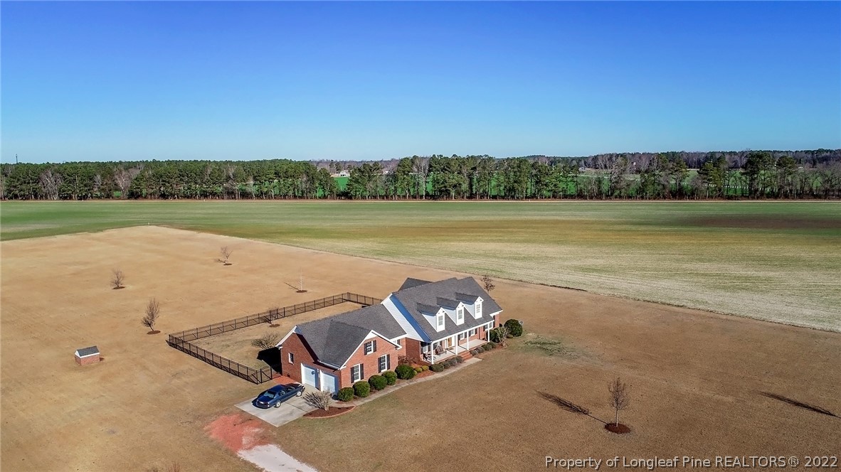 428 Rob Road Stedman, NC 28391 - Photo 44 of 45 an aerial view of a house with a lake view