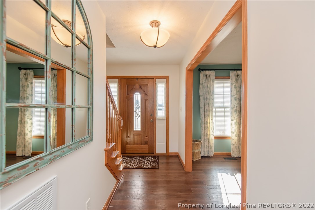 428 Rob Road Stedman, NC 28391 - Photo 5 of 45 a view of an entryway with wooden floor