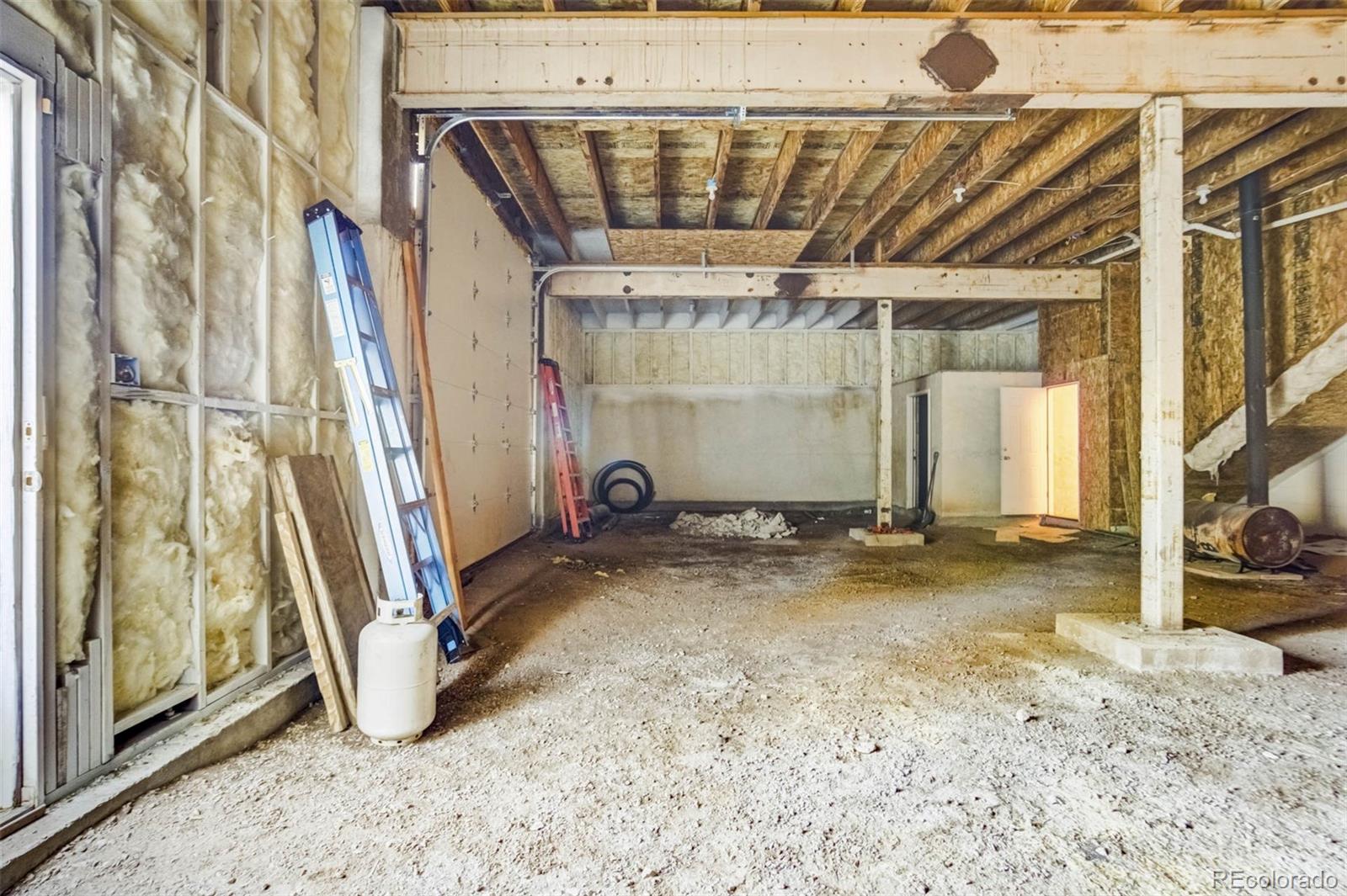 1440 North Range Road Guffey, CO 80820 - Photo 39 of 50 a view of a room with wooden walls