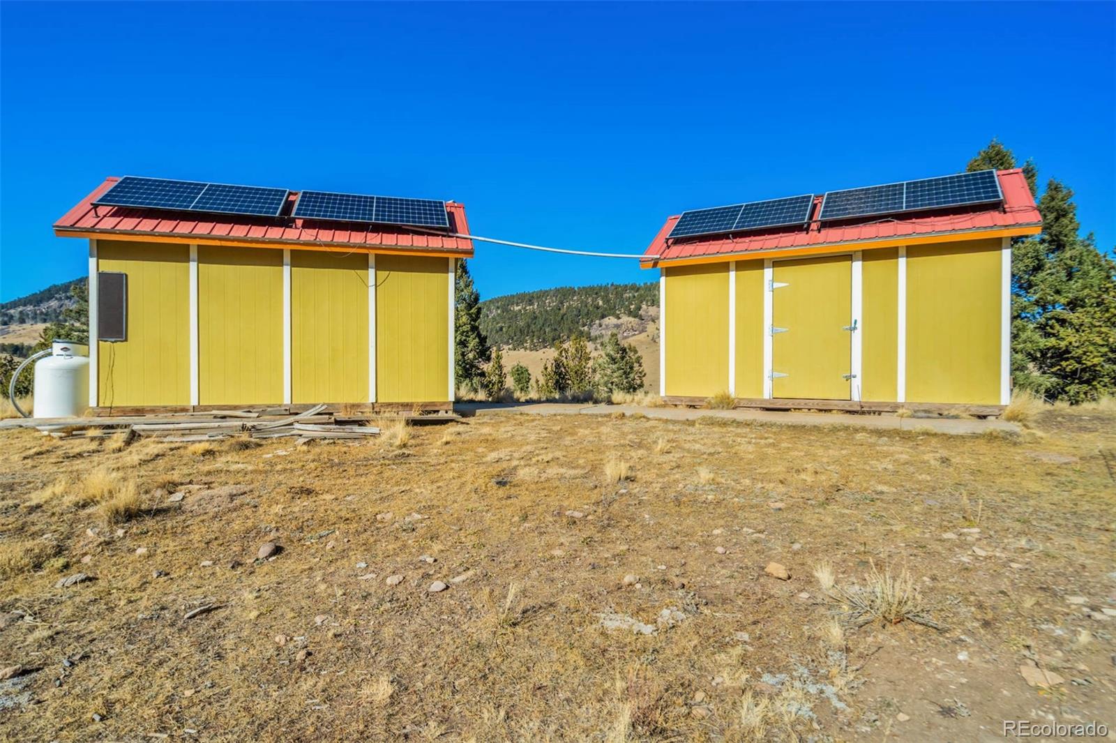 1440 North Range Road Guffey, CO 80820 - Photo 44 of 50 a front view of a house with a yard