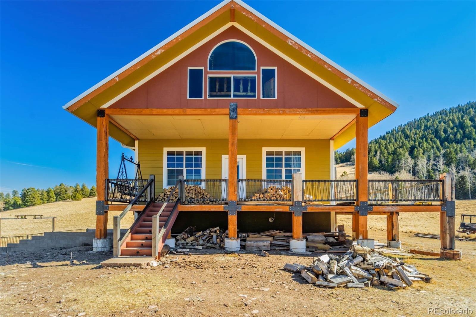 1440 North Range Road Guffey, CO 80820 - Photo 9 of 50 a front view of a house with a yard