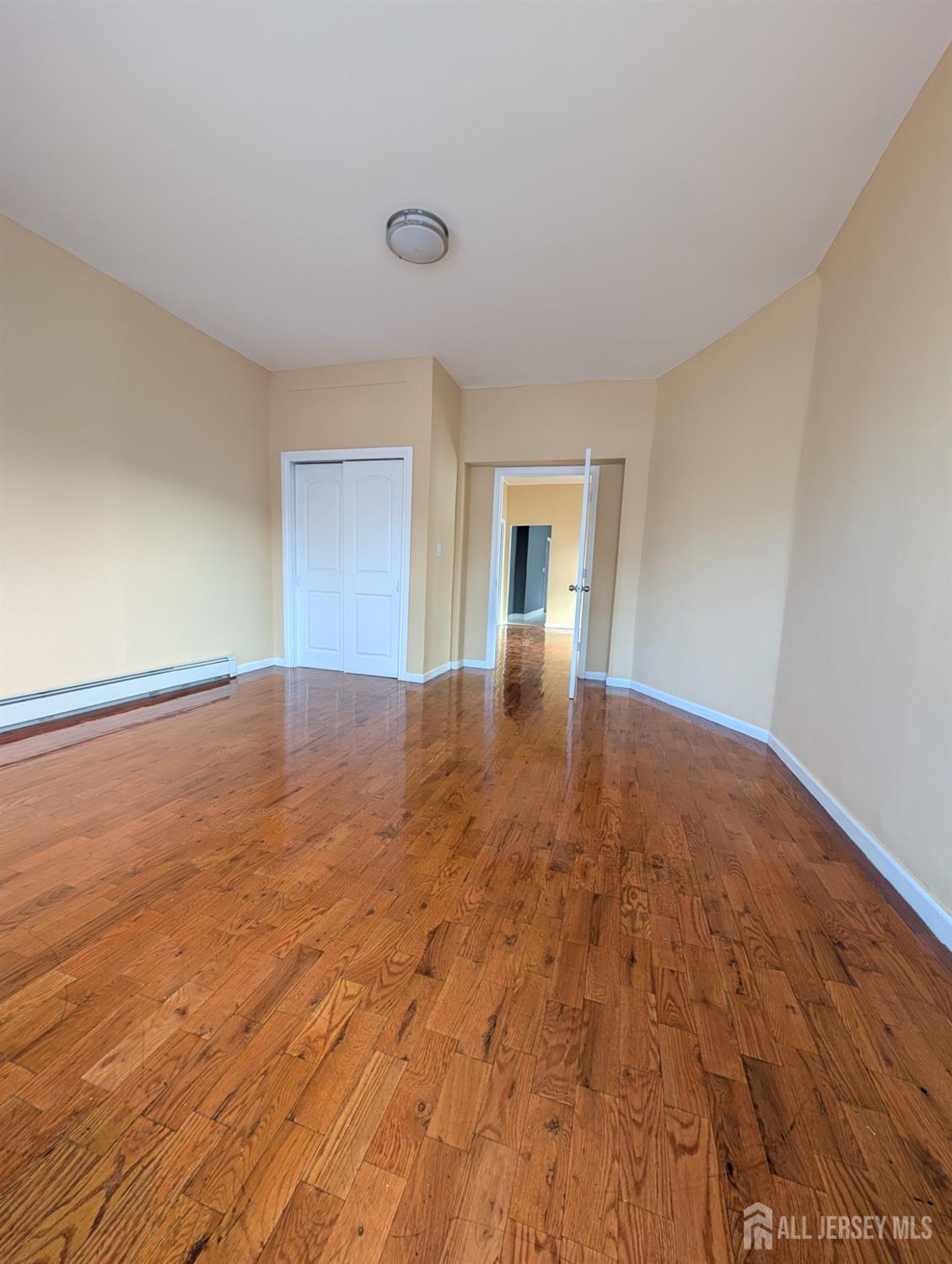 5 North 7th Street Newark, NJ 07107 - Photo 6 of 8 a view of empty room with wooden floor
