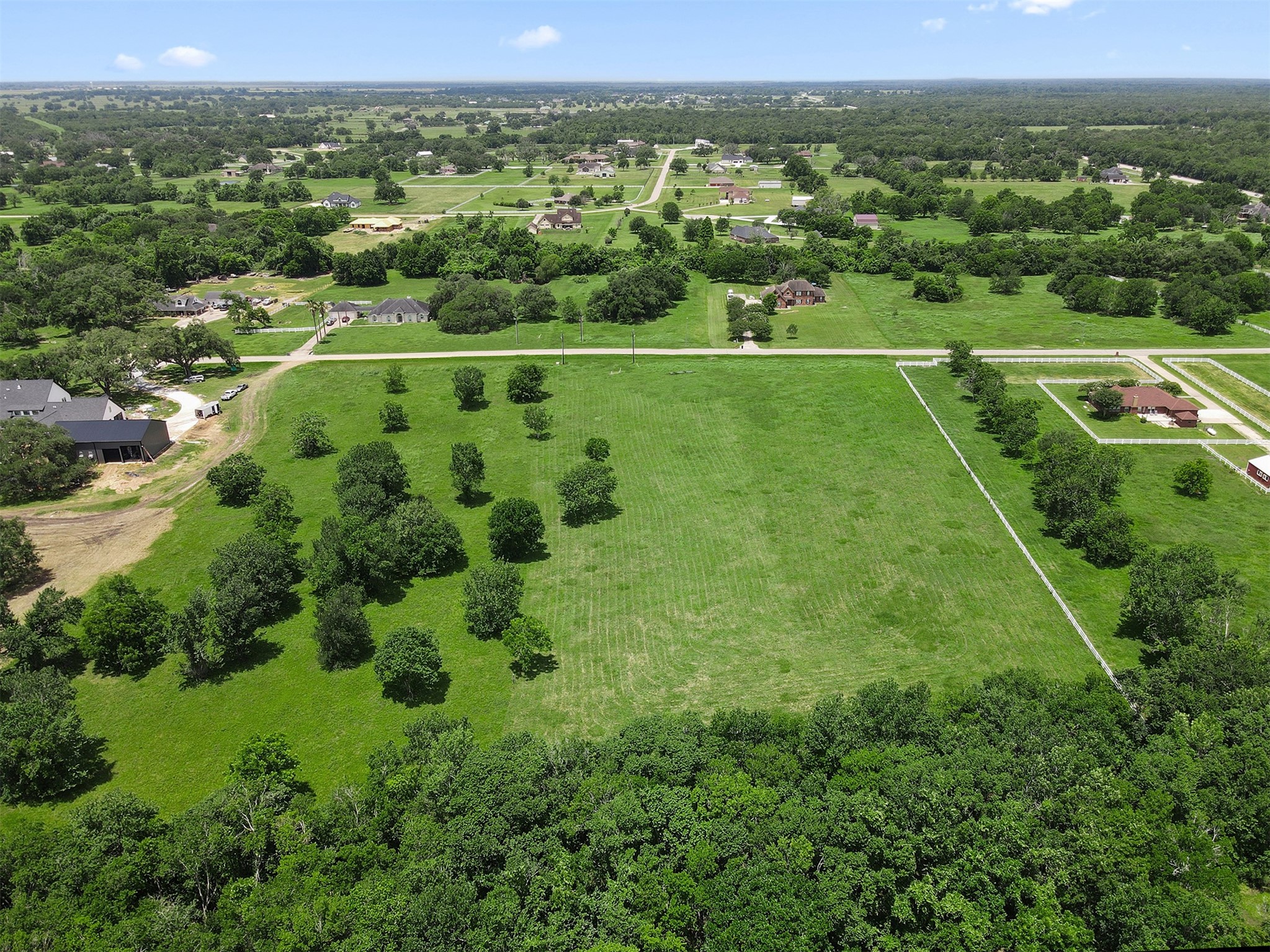 16403 Sun Valley Lane Rosharon, TX 77583 - Photo 2 of 15 an aerial view of residential houses with outdoor space and trees