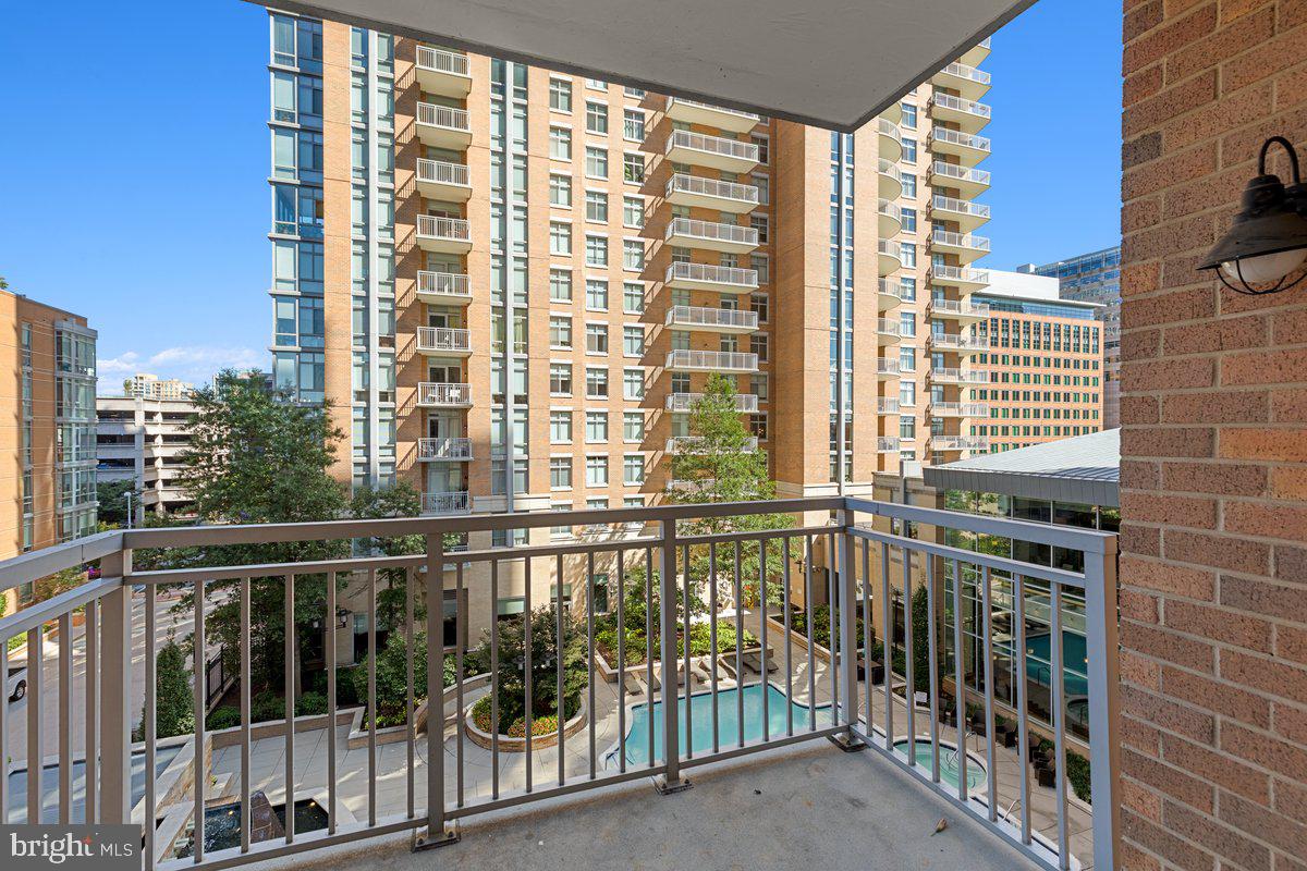 11990 Market Street, Unit 417 Reston, VA 20190 - Photo 26 of 43 Balcony view of pool and courtyard