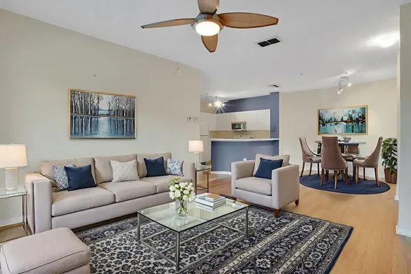 a living room with furniture and a rug
