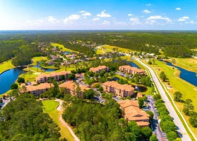 a view of a swimming pool with a yard