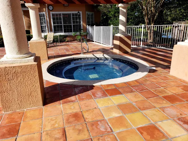 a view of a swimming pool with a patio