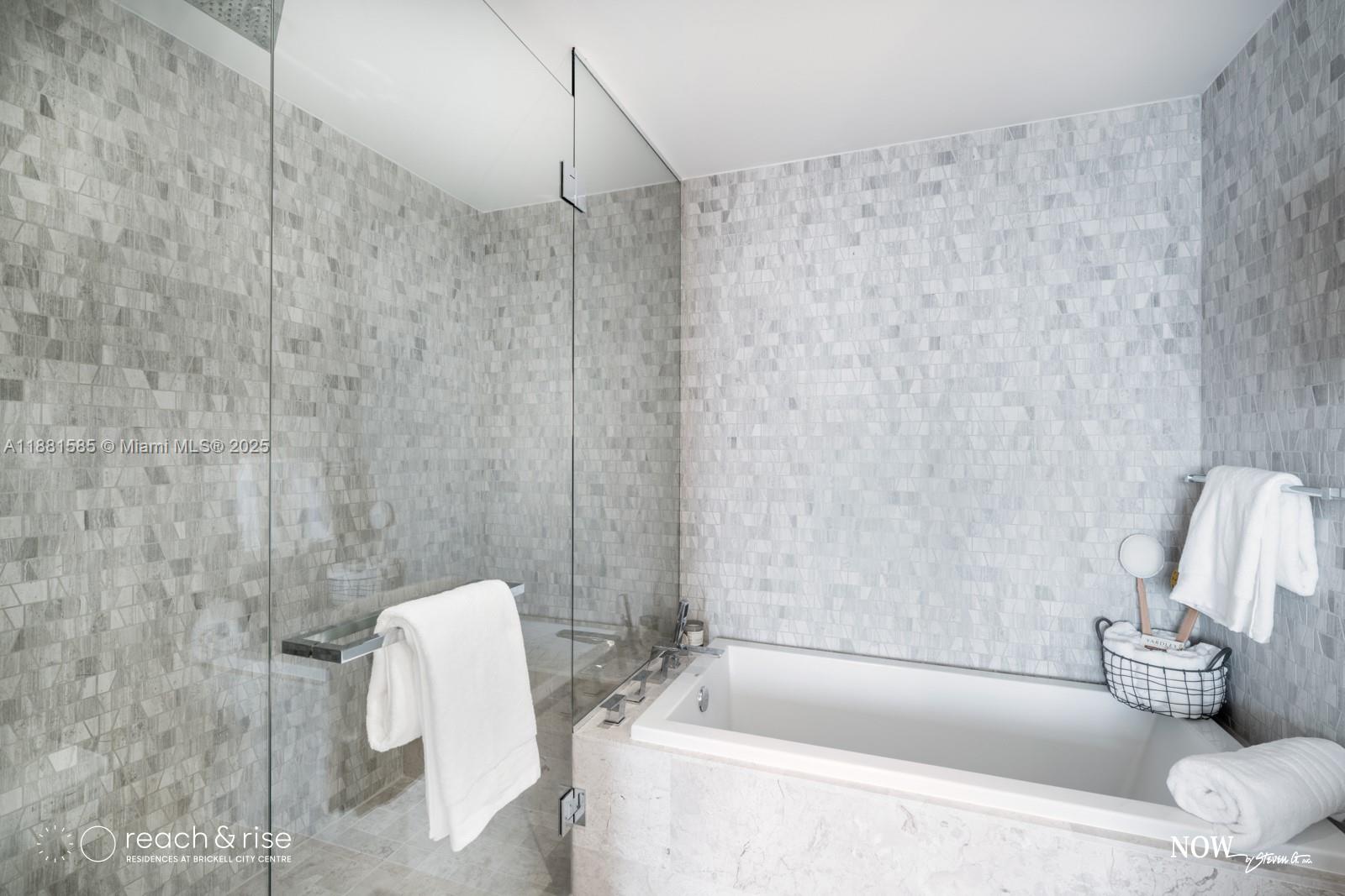 88 Southwest 7th Street, Unit 2406 Miami, FL 33130 - Photo 14 of 15 a bathroom with a bathtub and shower