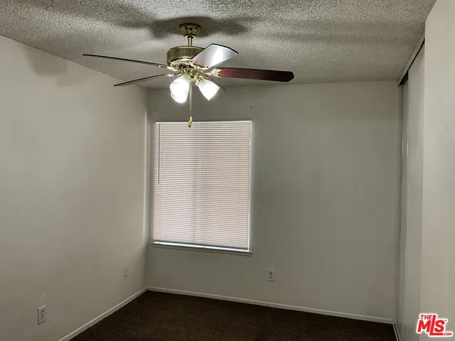 a bathroom with a shower and a glass door