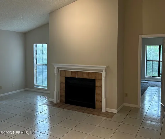 an empty room with fireplace