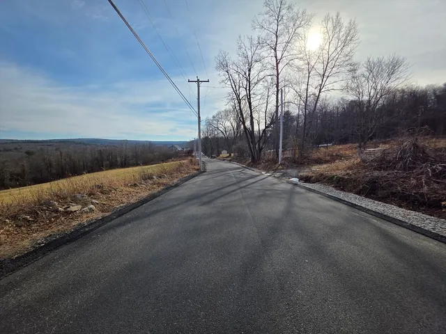 a view of a road with a building
