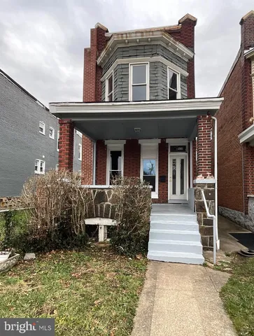 a front view of a house with a porch