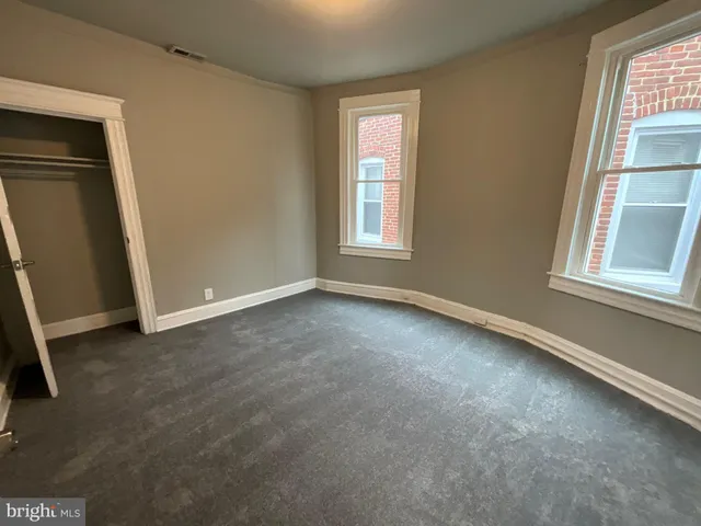 an empty room with windows