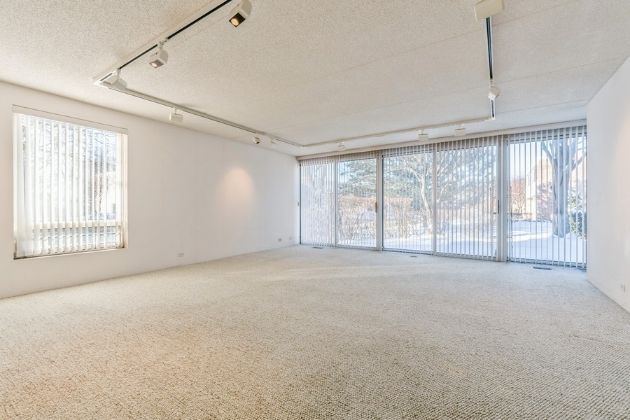 198 Wellington Road Northbrook, IL 60062 - Photo 3 of 14 a view of an empty room with a window
