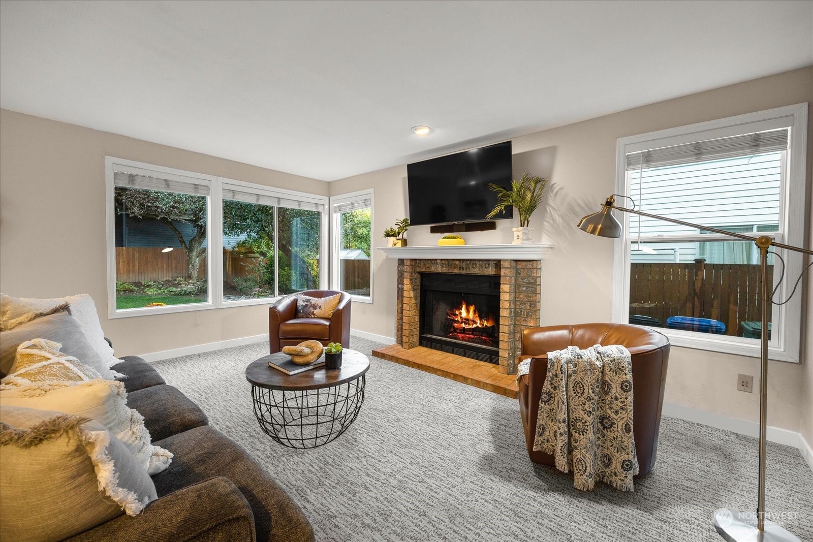 15114 92nd Place Northeast Bothell, WA 98011 - Photo 15 of 34 a living room with furniture a flat screen tv and a fireplace