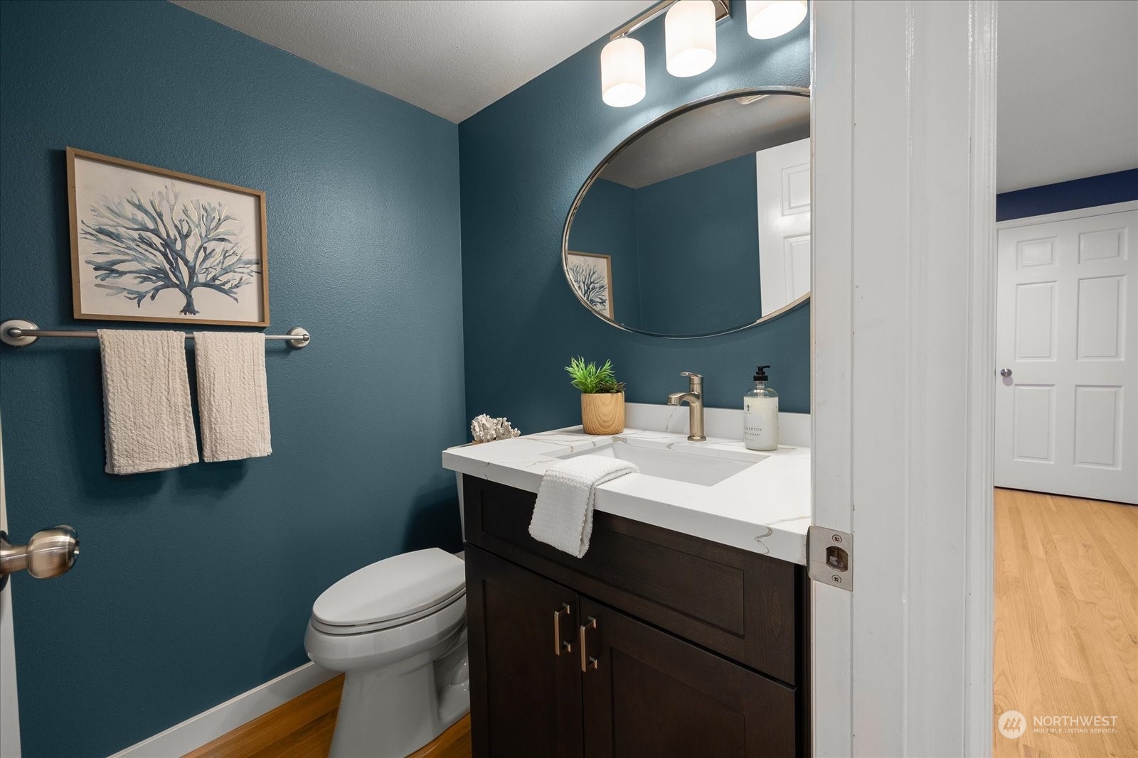 15114 92nd Place Northeast Bothell, WA 98011 - Photo 17 of 34 a bathroom with a sink vanity mirror and toilet