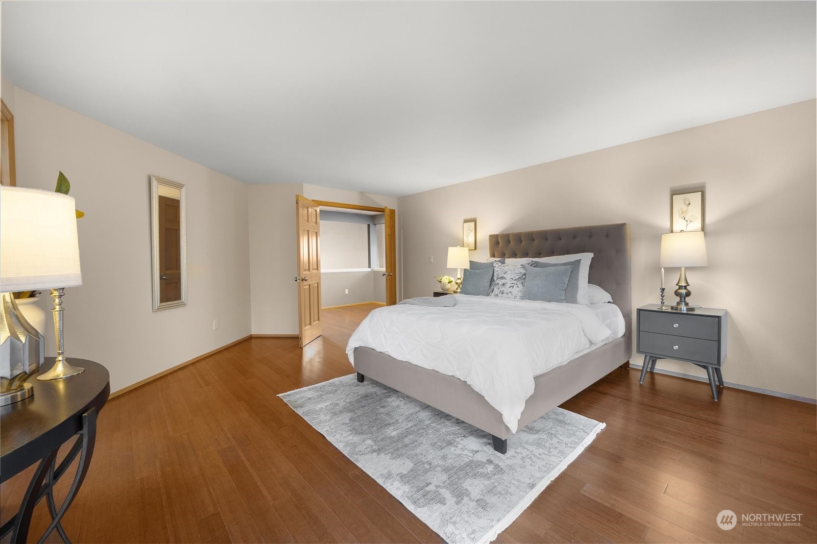 15114 92nd Place Northeast Bothell, WA 98011 - Photo 21 of 34 a bedroom with a bed and wooden floor