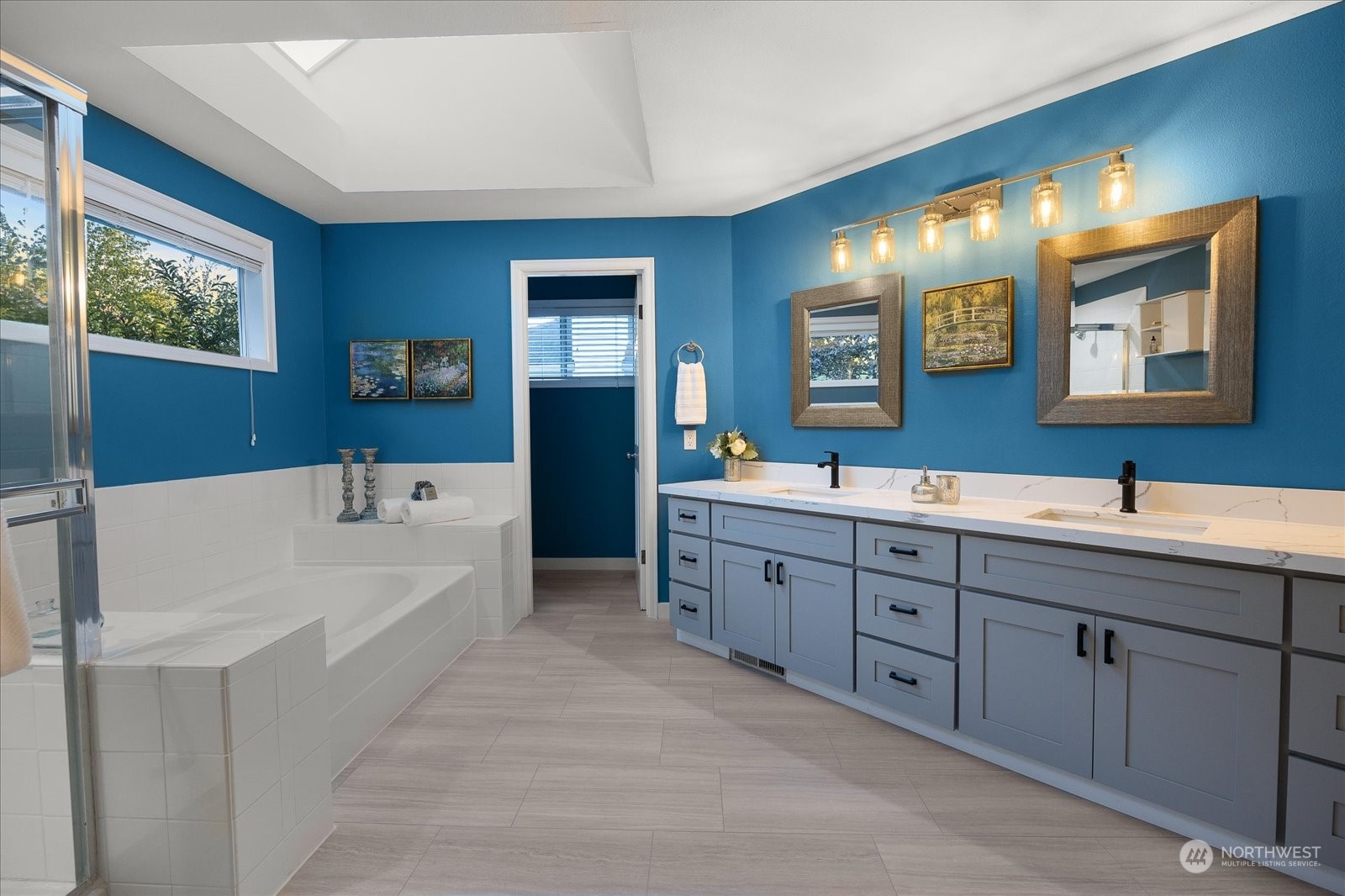 15114 92nd Place Northeast Bothell, WA 98011 - Photo 22 of 34 a bathroom with a tub double sink window and mirror