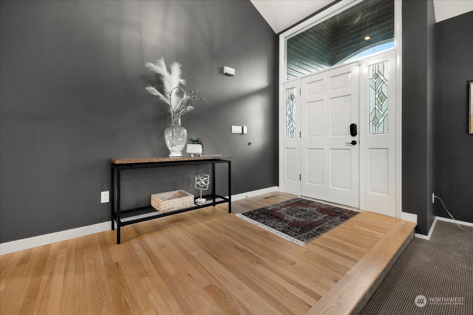 15114 92nd Place Northeast Bothell, WA 98011 - Photo 3 of 34 a bedroom with a bed and a chandelier