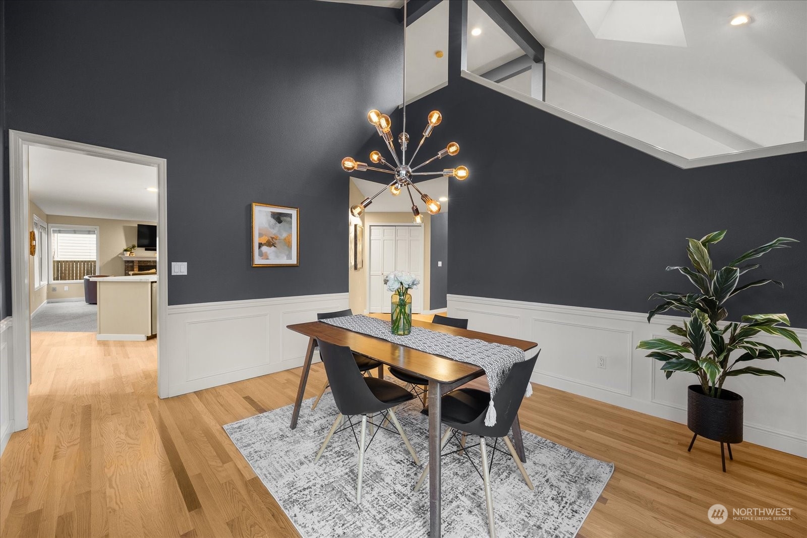 15114 92nd Place Northeast Bothell, WA 98011 - Photo 8 of 34 a dining room with furniture potted plants and wooden floor