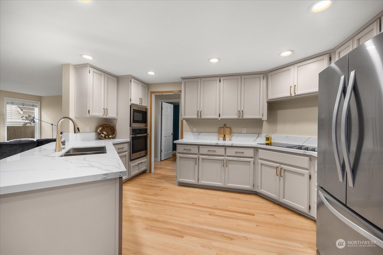 15114 92nd Place Northeast Bothell, WA 98011 - Photo 9 of 34 a kitchen with stainless steel appliances granite countertop a refrigerator sink and stove