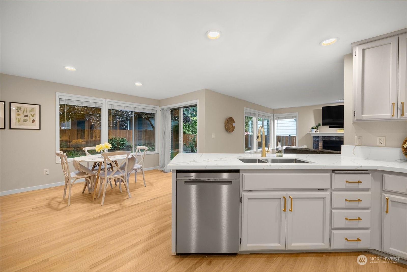 15114 92nd Place Northeast Bothell, WA 98011 - Photo 10 of 34 a kitchen with a table chairs and wooden floor