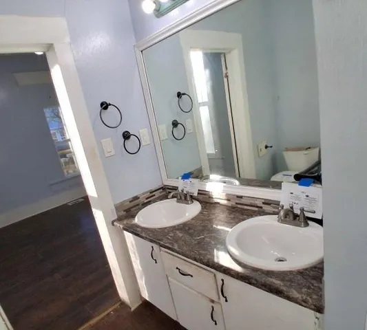 a bathroom with a sink and a mirror