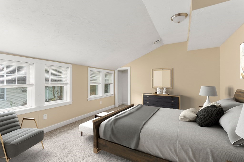 195 Eastern Avenue Worcester, MA 01605 - Photo 14 of 24 a bedroom with a bed and wooden floor