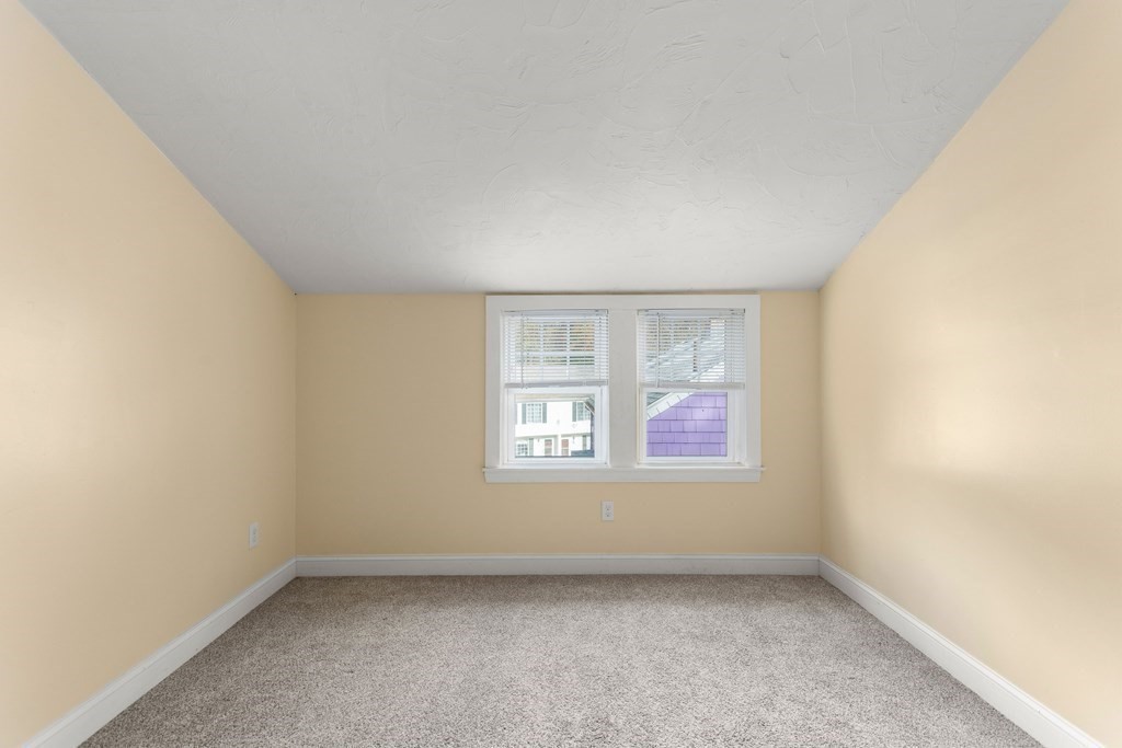 195 Eastern Avenue Worcester, MA 01605 - Photo 18 of 24 an empty room with a window