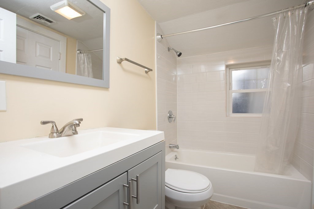195 Eastern Avenue Worcester, MA 01605 - Photo 20 of 24 a bathroom with a sink a toilet and shower